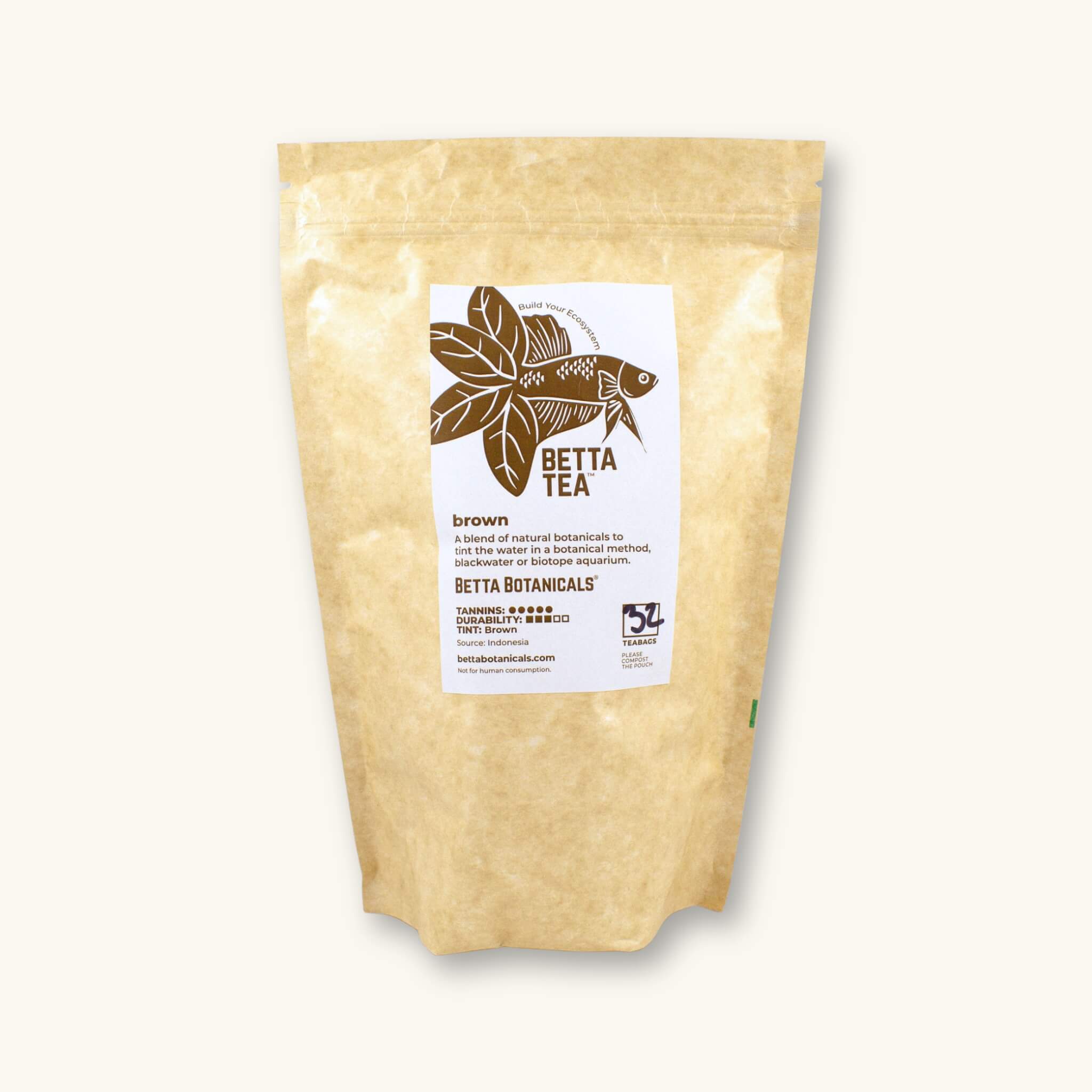 A kraft colored compostable pouch of 32 brown tinting tea bags, photographed against a natural background at Betta Botanicals.
