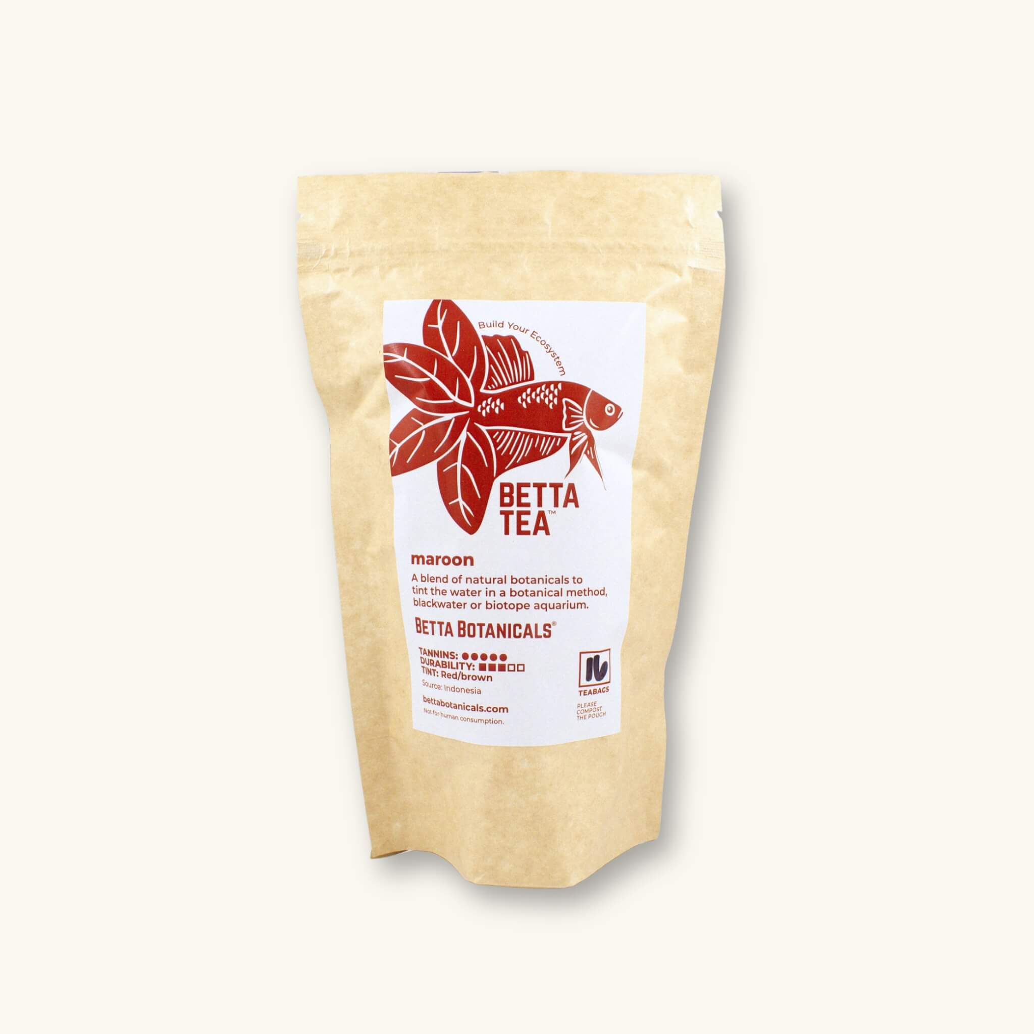 A kraft colored compostable pouch of 16 maroon tinting tea bags, photographed against a natural background at Betta Botanicals.