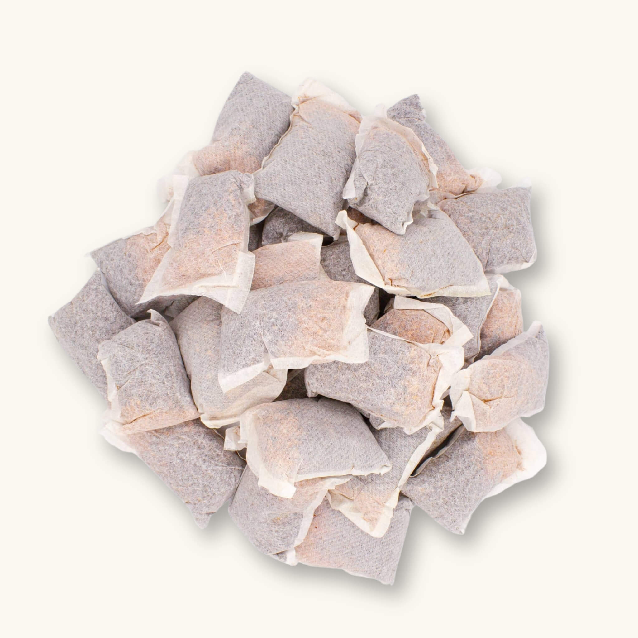 Betta Tea Bags with maroon tannin botanicals, photographed on a white background for blackwater aquarium use at Betta Botanicals.