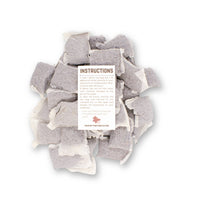 Betta Tea Bags containing dried botanicals of brown tannin botanicals, photographed on a white background for blackwater aquarium use at Betta Botanicals.