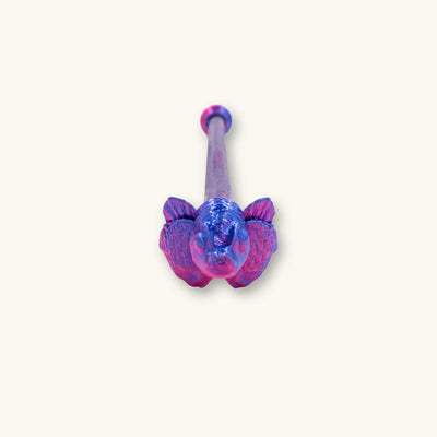A single betta fish flare stick in a two tone blue and purple color, 3D printed and photographed on a natural background.