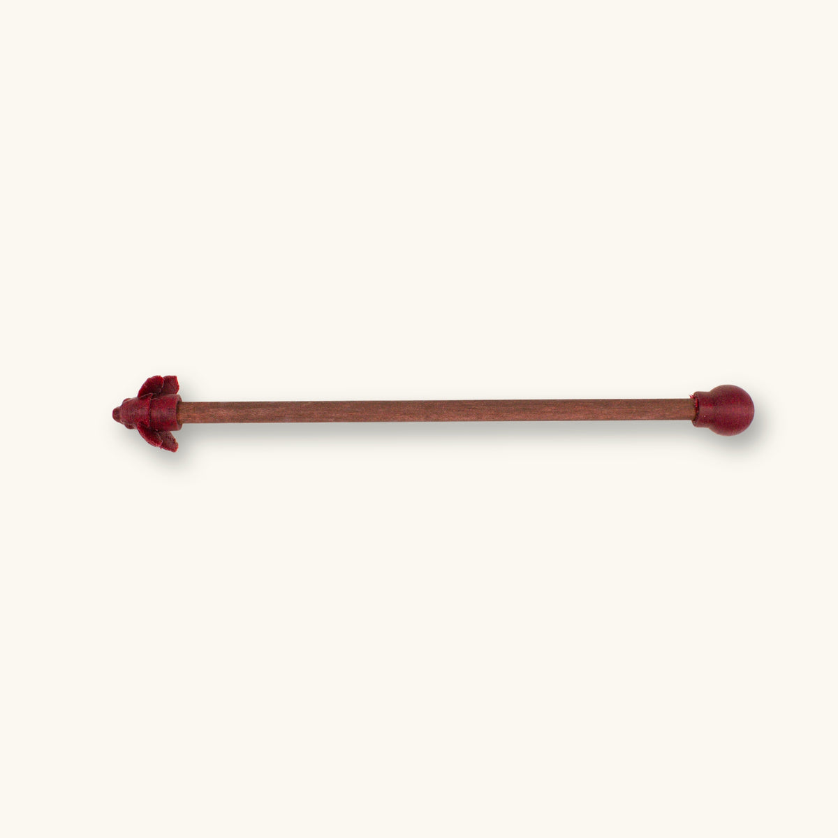 A single maroon betta fish flare stick photographed on a natural background.