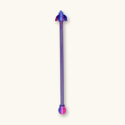 A single two-tone blue and purple betta fish flare stick photographed on a natural background.