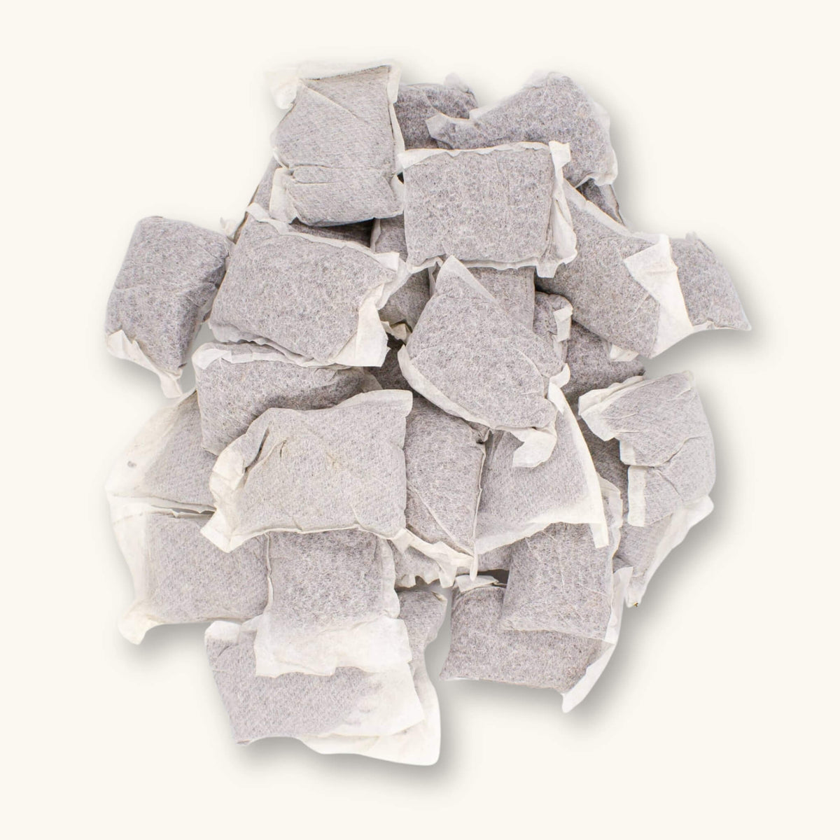Betta Tea Bags containing dried botanicals of brown tannin botanicals, photographed on a white background for blackwater aquarium use at Betta Botanicals.