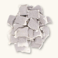 Betta Tea Bags containing dried botanicals of brown tannin botanicals, photographed on a white background for blackwater aquarium use at Betta Botanicals.