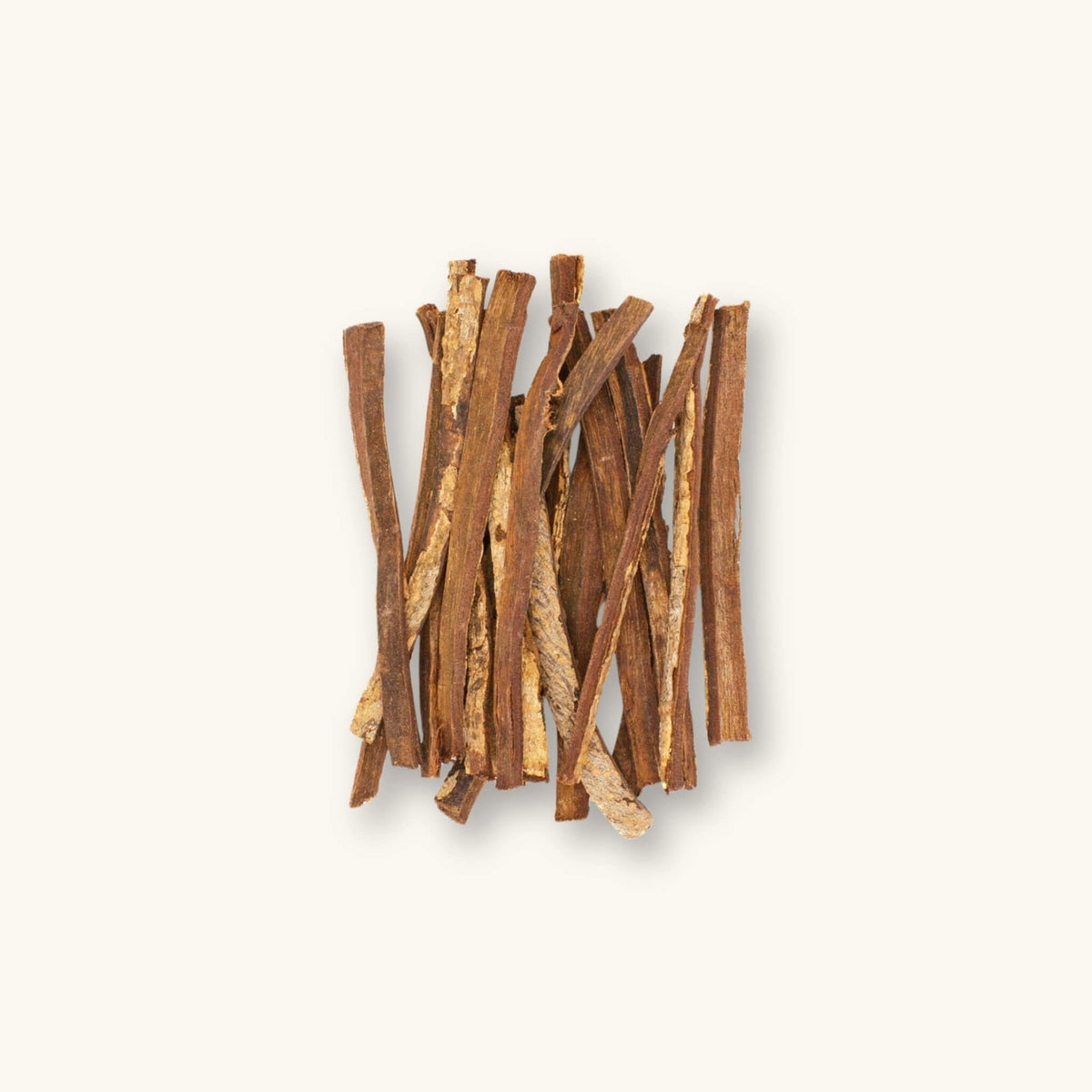 A collection of brown catappa bark sticks (Terminalia catappa) for blackwater aquariums, photographed on a natural background at Betta Botanicals.