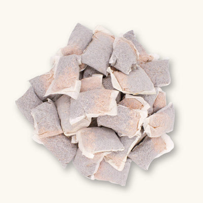 Betta Tea Bags with maroon tannin botanicals, photographed on a white background for blackwater aquarium use at Betta Botanicals.