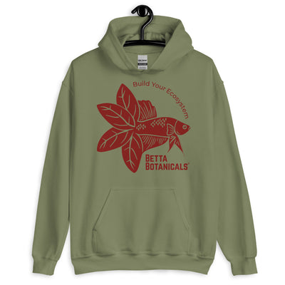 Unisex heavy-blend hoodie in military green with a maroon Betta Botanicals design, showcasing a Betta fish with leaf accents and the tagline ‘Build Your Ecosystem’.