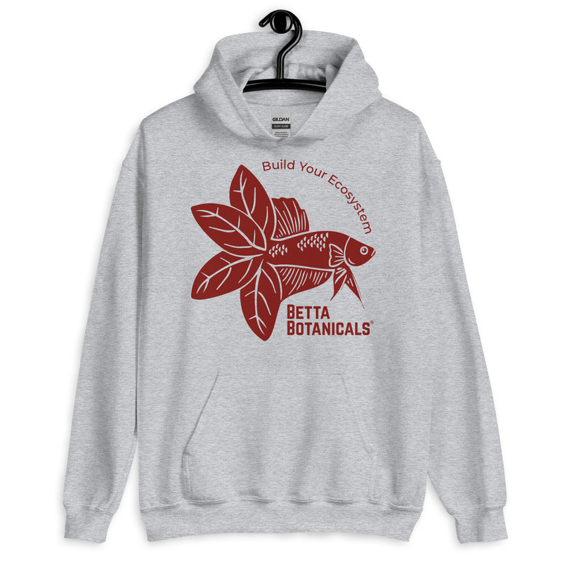 Unisex heavy-blend hoodie in sport gray featuring a maroon Betta Botanicals design with a Betta fish motif and the slogan ‘Build Your Ecosystem’.