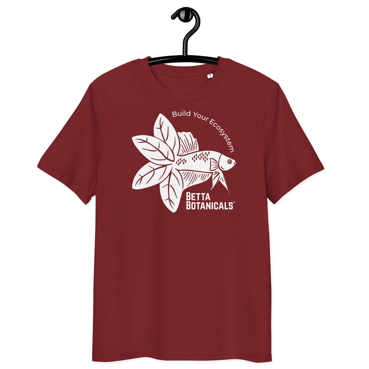 A maroon t-shirt with the Betta Botanicals logo, featuring a stylized fish surrounded by leaves and the slogan ‘Build Your Ecosystem,’ displayed on the front.