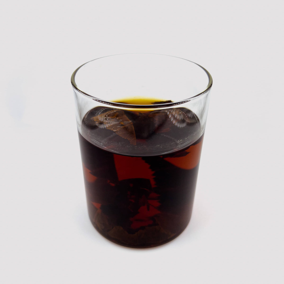 Indian Almond Leaves in a glass jar to show high tannin content by Betta Botanicals, aquarium botanicals for blackwater betta fish. 