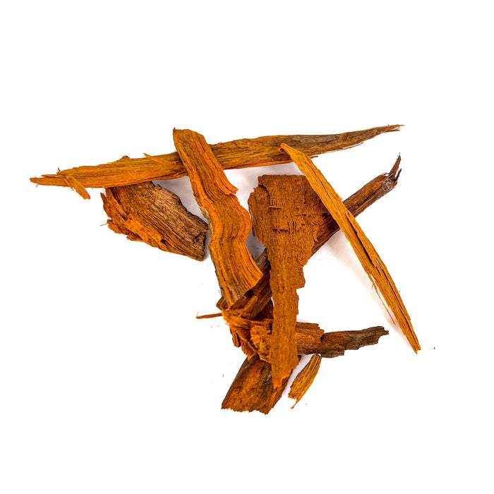 Pile of rough and orange sappan wood pieces for aquariums by Betta Botanicals.